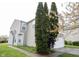 Attractive side view of a well-maintained home with manicured landscaping and a neatly paved walkway at 4545 Connaught East Dr, Plainfield, IN 46168