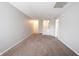 A spacious living room with carpeted floors and neutral colored walls at 4545 Connaught East Dr, Plainfield, IN 46168