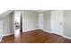 A spacious bedroom with hardwood floors and white trim at 4640 Boulevard Pl, Indianapolis, IN 46208