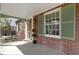 Inviting front porch with brick accents and a view of the front door at 4640 Boulevard Pl, Indianapolis, IN 46208