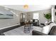Comfortable living room featuring neutral tones, stylish sofas, and hardwood floors at 4640 Boulevard Pl, Indianapolis, IN 46208