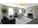 Cozy living room with stylish sofas, a fireplace, and built-in shelving at 4640 Boulevard Pl, Indianapolis, IN 46208
