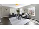 Spacious living room with natural light, hardwood floors, and comfortable seating at 4640 Boulevard Pl, Indianapolis, IN 46208
