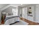 Bright and inviting main bedroom with hardwood floors and an ensuite bathroom at 4640 Boulevard Pl, Indianapolis, IN 46208