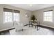 Cozy office with lots of natural light, white rug, and neutral paint at 4640 Boulevard Pl, Indianapolis, IN 46208