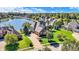 Beautiful home with a manicured lawn and landscaping near a picturesque lake at 4843 Snowberry Bay Ct, Carmel, IN 46033