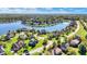 Picturesque aerial shot features a neighborhood with homes surrounded by lush green lawns and trees at 4843 Snowberry Bay Ct, Carmel, IN 46033