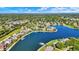 Scenic aerial shot of waterfront homes, featuring a beautiful lake and lush green landscaping at 4843 Snowberry Bay Ct, Carmel, IN 46033