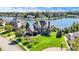 Beautiful home with a manicured lawn and landscaping near a picturesque lake at 4843 Snowberry Bay Ct, Carmel, IN 46033