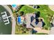Overhead image of home with deck, in-ground pool, and boat dock on the water at 4843 Snowberry Bay Ct, Carmel, IN 46033
