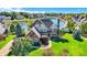 Aerial shot showcasing lush landscaping and lake views, enhancing this home's appeal at 4843 Snowberry Bay Ct, Carmel, IN 46033