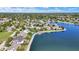 Beautiful aerial view of lakeside real estate showcasing waterfront homes with private docks and landscaping at 4843 Snowberry Bay Ct, Carmel, IN 46033