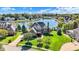Beautiful home with a manicured lawn and landscaping near a picturesque lake at 4843 Snowberry Bay Ct, Carmel, IN 46033
