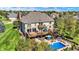 Large backyard features a swimming pool, upper-level wood deck, lower-level patio, and mature trees at 4843 Snowberry Bay Ct, Carmel, IN 46033