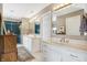 Bright bathroom featuring a double vanity, with marble countertops, white cabinetry and a glass shower at 4843 Snowberry Bay Ct, Carmel, IN 46033