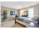 A serene bedroom with natural light includes decorative plants and a cozy bed at 4843 Snowberry Bay Ct, Carmel, IN 46033