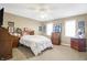 Comfortable bedroom featuring a ceiling fan, many windows, and plenty of space for furnishings at 4843 Snowberry Bay Ct, Carmel, IN 46033