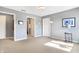 Bright bedroom with gray walls, neutral carpet, and a view to an adjoined room at 4843 Snowberry Bay Ct, Carmel, IN 46033
