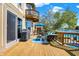 Spacious deck offers seamless indoor-outdoor living with comfortable seating, lake views, and access to the home's interior at 4843 Snowberry Bay Ct, Carmel, IN 46033