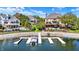 Picture showing private dock with boat lift on a tranquil lake near lush greenery at 4843 Snowberry Bay Ct, Carmel, IN 46033