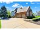 Two-car garage connected to a brick home, featuring a spacious driveway and well-maintained landscaping at 4843 Snowberry Bay Ct, Carmel, IN 46033