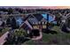 Charming home with brick facade, lush landscaping, and waterfront views on a large lot at 4843 Snowberry Bay Ct, Carmel, IN 46033