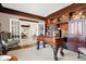 Cozy home office featuring wood trim, built-in cabinets, a unique desk, and serene ambiance at 4843 Snowberry Bay Ct, Carmel, IN 46033