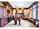 Inviting home office with a fireplace, wooden built-ins, and a unique desk for an inspiring workspace at 4843 Snowberry Bay Ct, Carmel, IN 46033