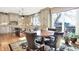 Open kitchen with custom cabinets, large windows and a dining table at 4843 Snowberry Bay Ct, Carmel, IN 46033
