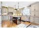 This spacious kitchen boasts a large central island, stainless steel appliances, and bright, modern lighting at 4843 Snowberry Bay Ct, Carmel, IN 46033