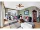 Inviting living room with hardwood floors, large windows, and neutral decor at 4843 Snowberry Bay Ct, Carmel, IN 46033