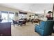 Spacious living room features plush seating, bay windows, and a seamless blend of comfort and style at 4843 Snowberry Bay Ct, Carmel, IN 46033