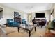Cozy living room with fireplace, comfortable seating, and a large flat screen television at 4843 Snowberry Bay Ct, Carmel, IN 46033