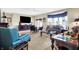 This warm, inviting living room offers a ceiling fan and comfortable seating, perfect for relaxing and entertaining at 4843 Snowberry Bay Ct, Carmel, IN 46033