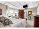 Bright bedroom features plush carpet, coffered ceiling, balcony access, and ample closet space at 4843 Snowberry Bay Ct, Carmel, IN 46033
