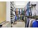 Large walk-in closet featuring plenty of hanging storage and shelving for shoes and folded items at 4843 Snowberry Bay Ct, Carmel, IN 46033