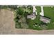 Spacious property featuring a well-maintained lawn, mature trees and detached structures at 5210 S 100 E Rd, Anderson, IN 46013
