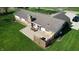 A large, private backyard with stone patio and wooden fence, perfect for outdoor entertaining at 5210 S 100 E Rd, Anderson, IN 46013