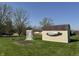 Spacious backyard with a storage shed, garden, white arbor and lush green grass, perfect for outdoor enjoyment at 5210 S 100 E Rd, Anderson, IN 46013