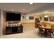 Basement featuring a dining table, entertainment center, and neutral color scheme at 5210 S 100 E Rd, Anderson, IN 46013