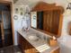 Bathroom boasting a vanity with framed mirror, ample lighting, and neutral décor at 5210 S 100 E Rd, Anderson, IN 46013