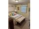 Cozy bedroom featuring floral wallpaper, a brass bed frame, and a matching quilt at 5210 S 100 E Rd, Anderson, IN 46013