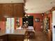 Inviting dining room boasting an elegant chandelier, floral tablecloth, and rustic decor at 5210 S 100 E Rd, Anderson, IN 46013