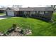 Charming single-story home featuring a well-manicured lawn and stone accents at 5210 S 100 E Rd, Anderson, IN 46013