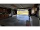 Well-organized garage with ample storage space and natural light showcasing the inviting driveway at 5210 S 100 E Rd, Anderson, IN 46013