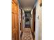 Inviting hallway with wooden trim, hardwood floors, and a decorative runner at 5210 S 100 E Rd, Anderson, IN 46013