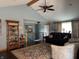 Open-concept living room with vaulted ceilings, a cozy fireplace and natural light creating a warm atmosphere at 5210 S 100 E Rd, Anderson, IN 46013