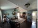 A spacious living room featuring a vaulted ceiling, hardwood floors and a cozy fireplace at 5210 S 100 E Rd, Anderson, IN 46013