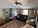 Inviting living room featuring a ceiling fan, comfortable seating, and elegant decor at 5210 S 100 E Rd, Anderson, IN 46013