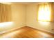 Bright bedroom with hardwood floors and large windows, creating a warm and inviting atmosphere at 5363 Channing Rd, Indianapolis, IN 46226